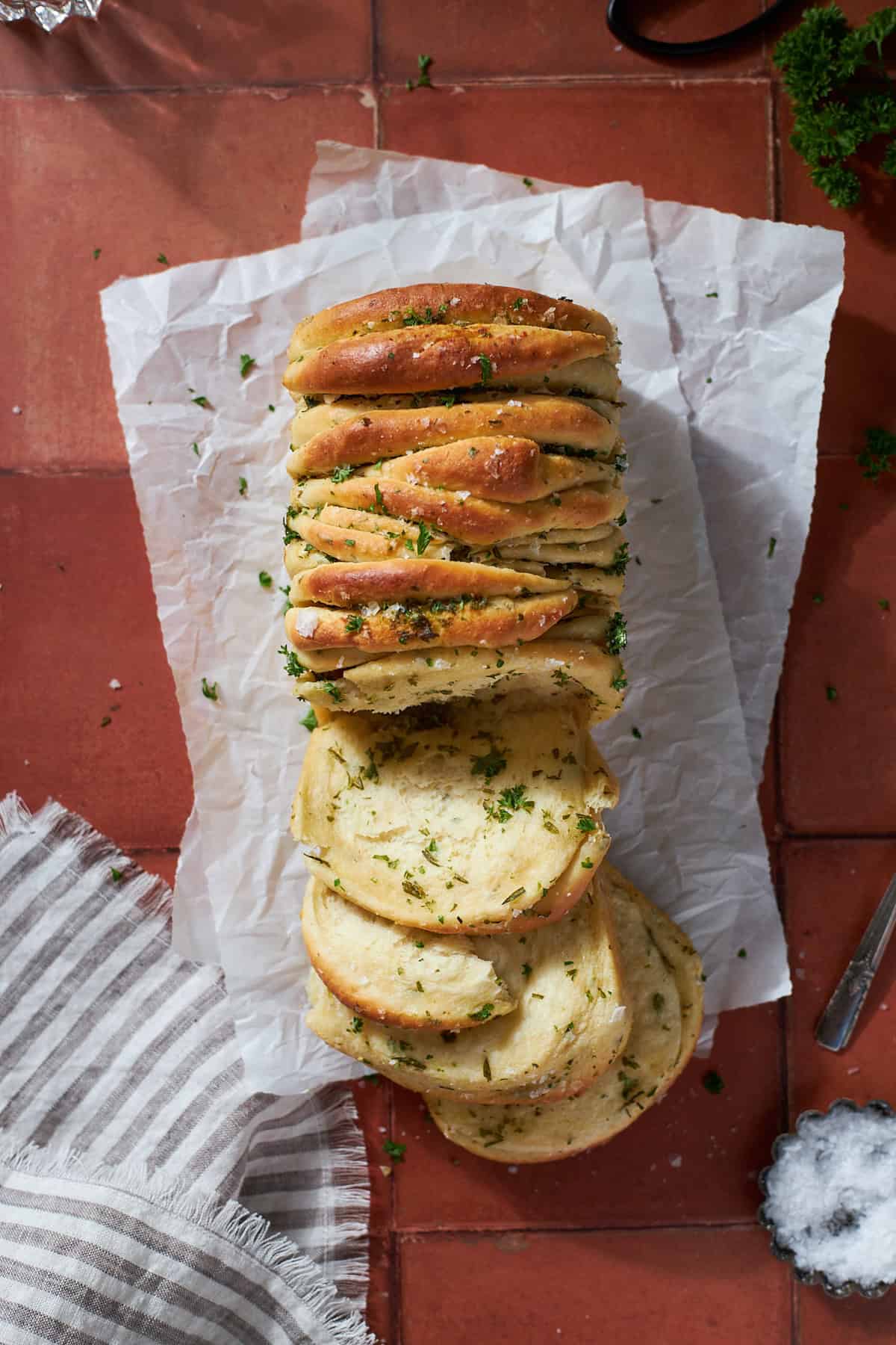 Sourdough Discard Garlic Pull Apart Bread with a few slices pulled out.
