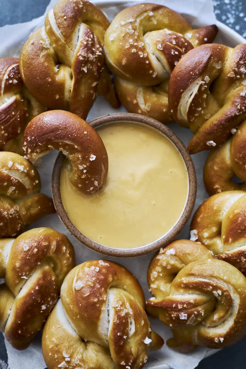 Honey Mustard Dipping Sauce in a small bowl with soft pretzels.