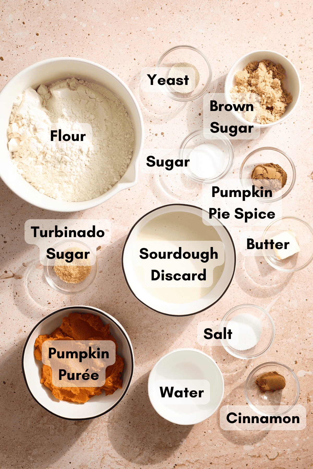 Ingredients for Sourdough Discard Pumpkin Bagels in small bowls. 