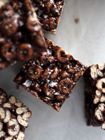 Chocolate Rice Krispies on white parchment paper.