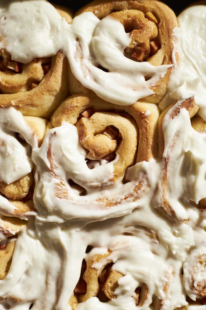 Overhead view of Sourdough Discard Apple Cinnamon Rolls with frosting.