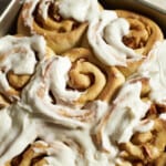 Closeup of Sourdough Discard Apple Cinnamon Rolls with frosting.