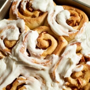 Closeup of Sourdough Discard Apple Cinnamon Rolls with frosting.