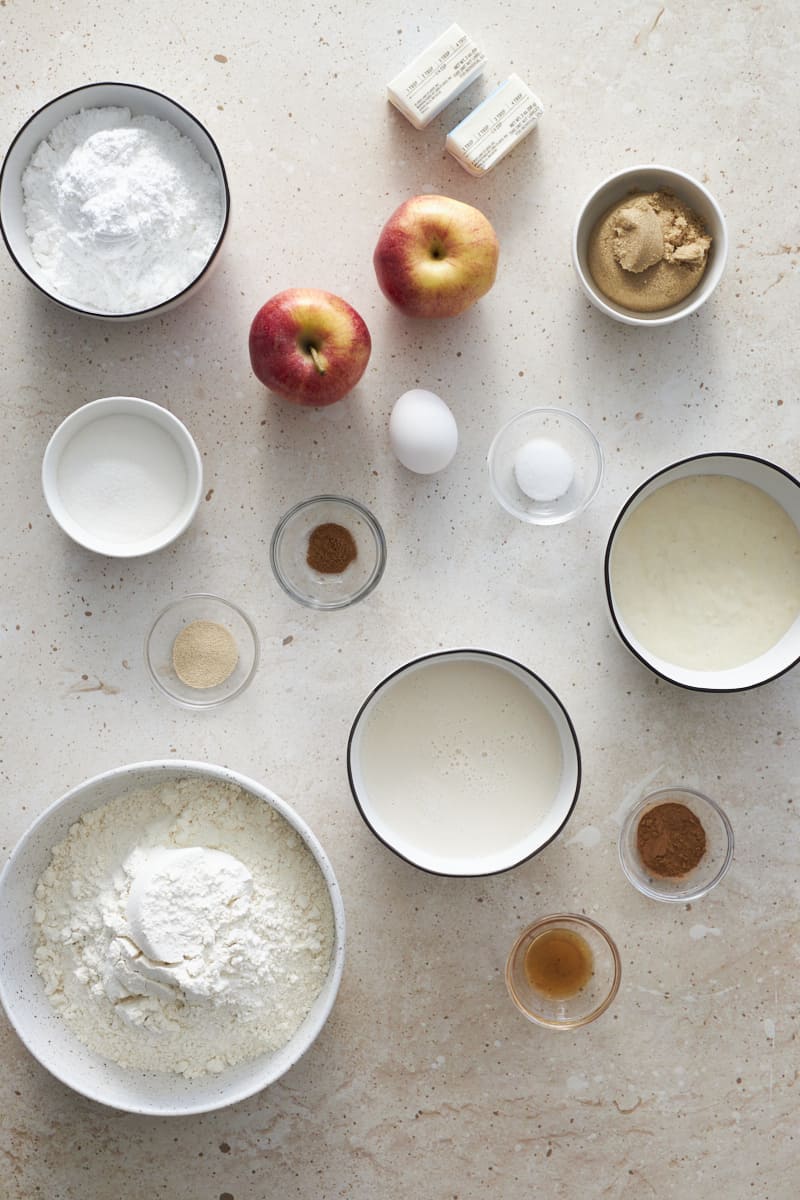 Ingredients for Sourdough Discard Apple Cinnamon Rolls in small bowls.