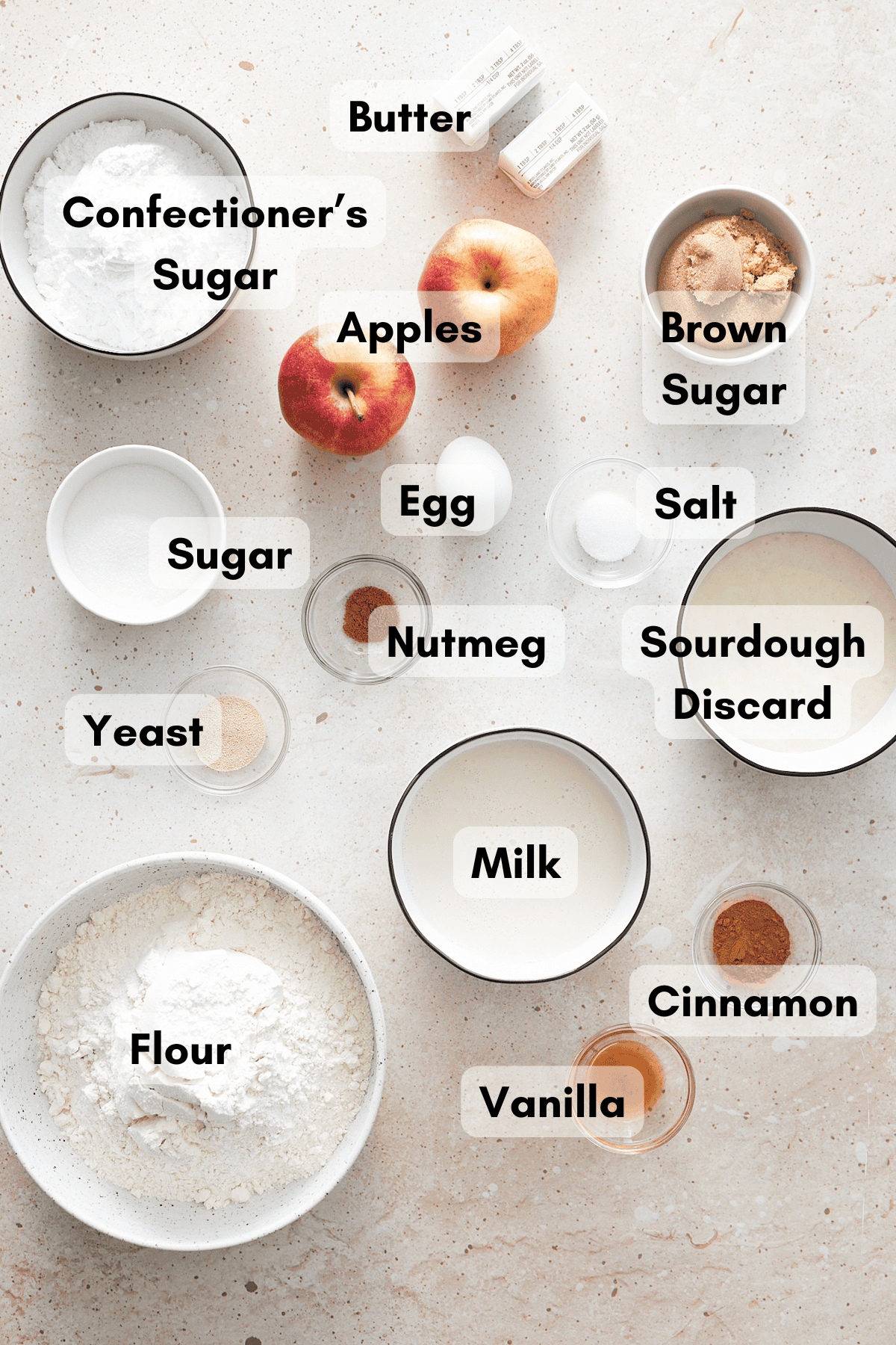 Ingredients for Sourdough Discard Apple Cinnamon Rolls in small bowls. 
