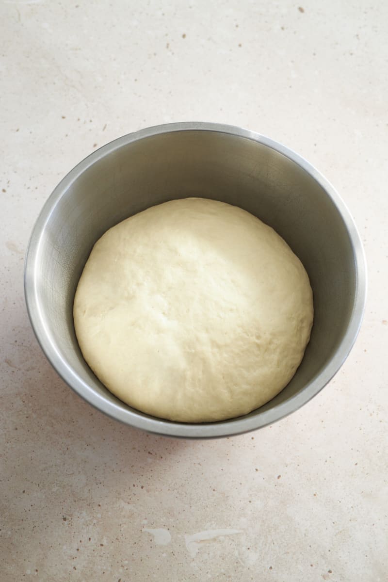 Dough in a large bowl after rising.