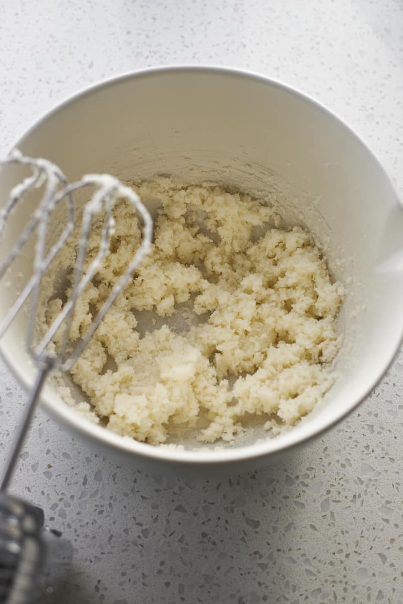 Sugar and butter creamed in a large bowl.