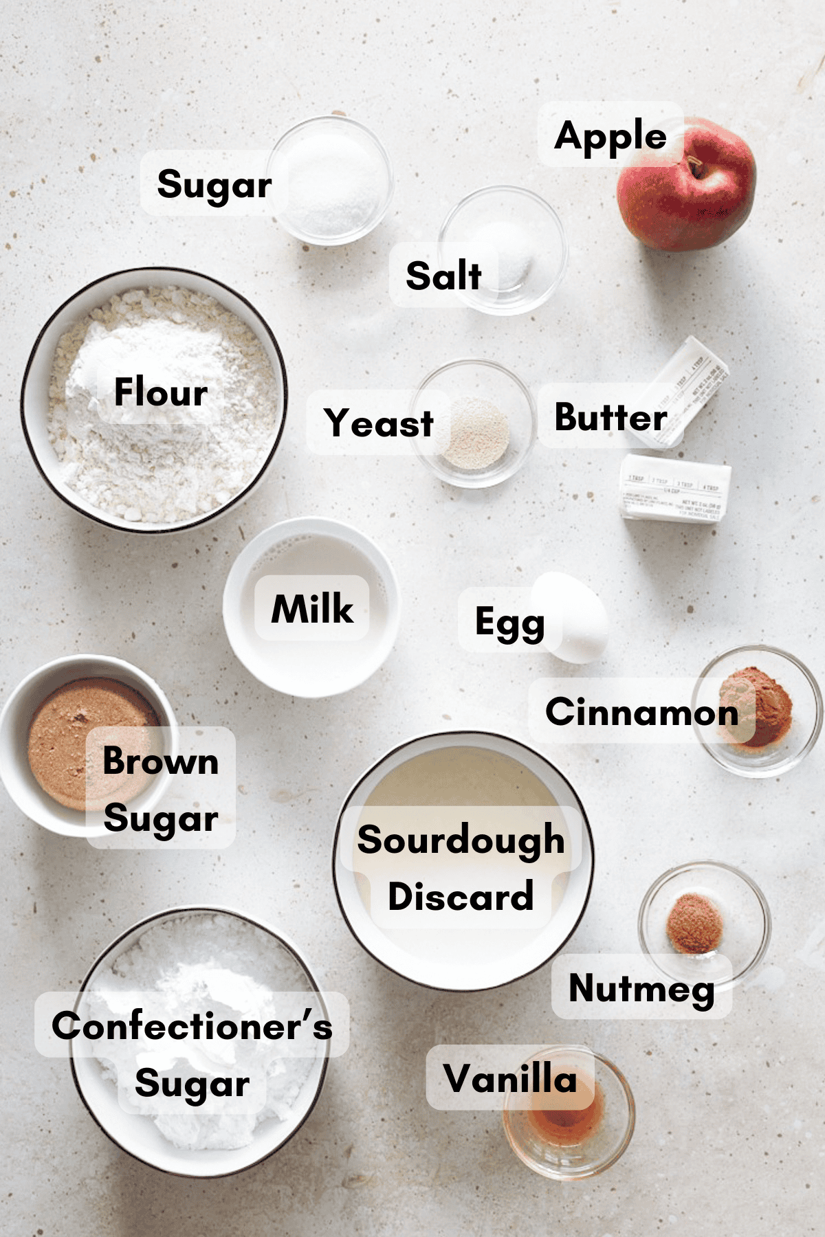 Ingredients for Sourdough Discard Apple Pull Apart Bread in small bowls. 