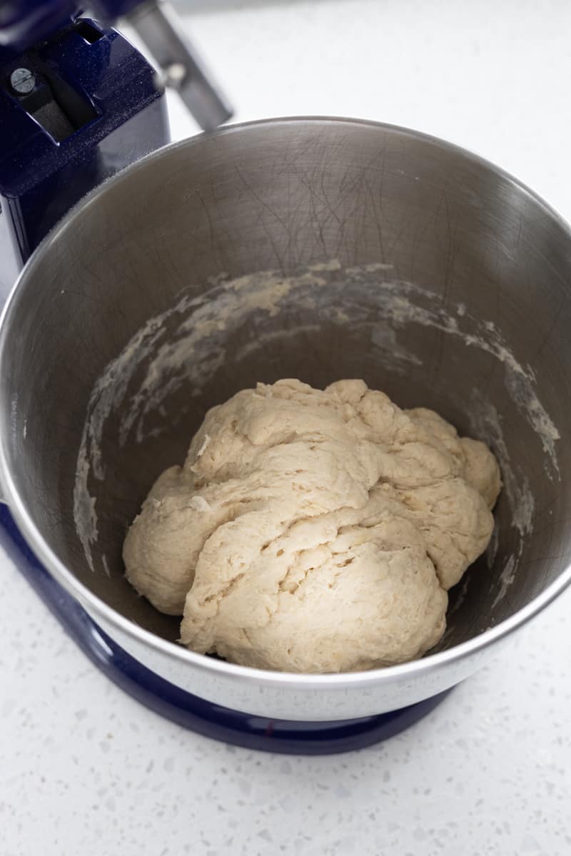 Dough in the bowl of a stand mixer.