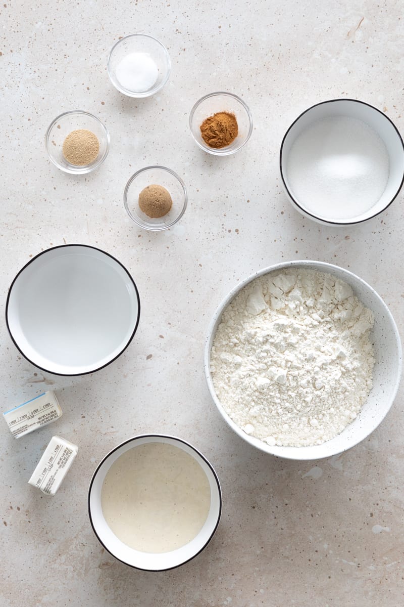 Ingredients for Sourdough Discard Cinnamon Sugar Pretzels in small bowls.