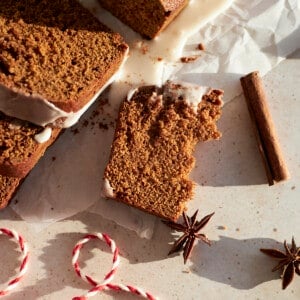 A piece Sourdough Discard Gingerbread Loaf broken in half.