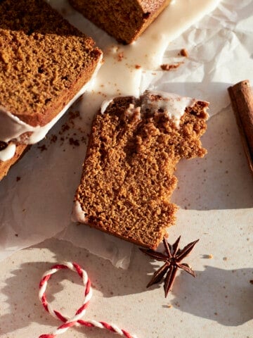 A piece Sourdough Discard Gingerbread Loaf broken in half.