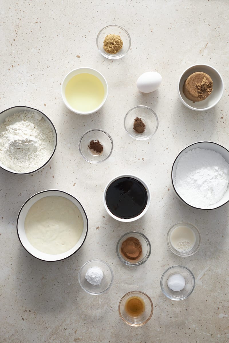 Ingredients for a Sourdough Discard Gingerbread Loaf in small bowls.