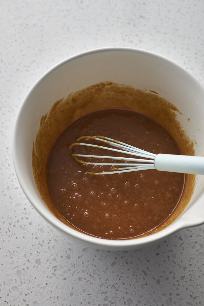 Wet ingredients whisked together in a large bowl.