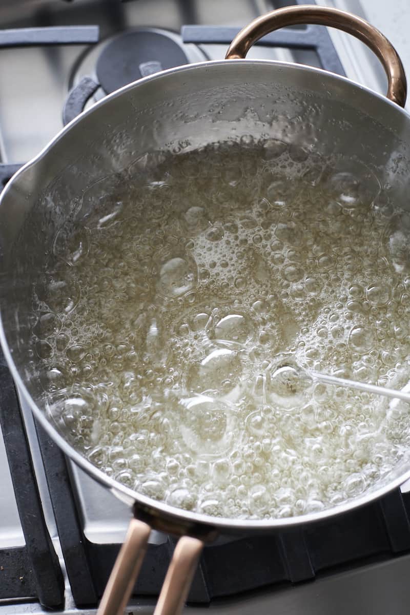 Sugar mixture boiling in a pot.