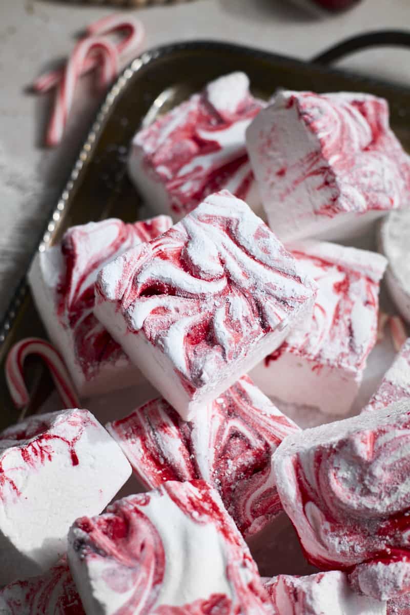 A closeup of Candy Cane Marshmallows on a silver platter.