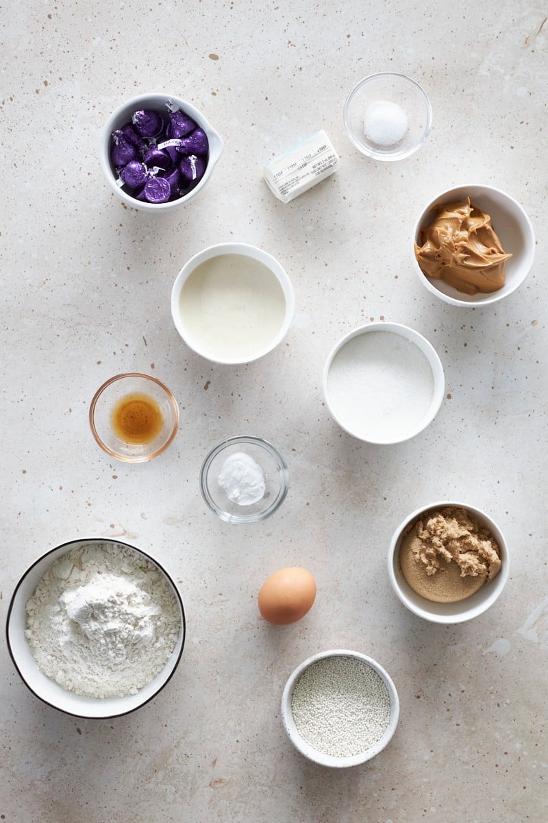 Ingredients for Sourdough Discard Peanut Butter Blossoms in small bowls.