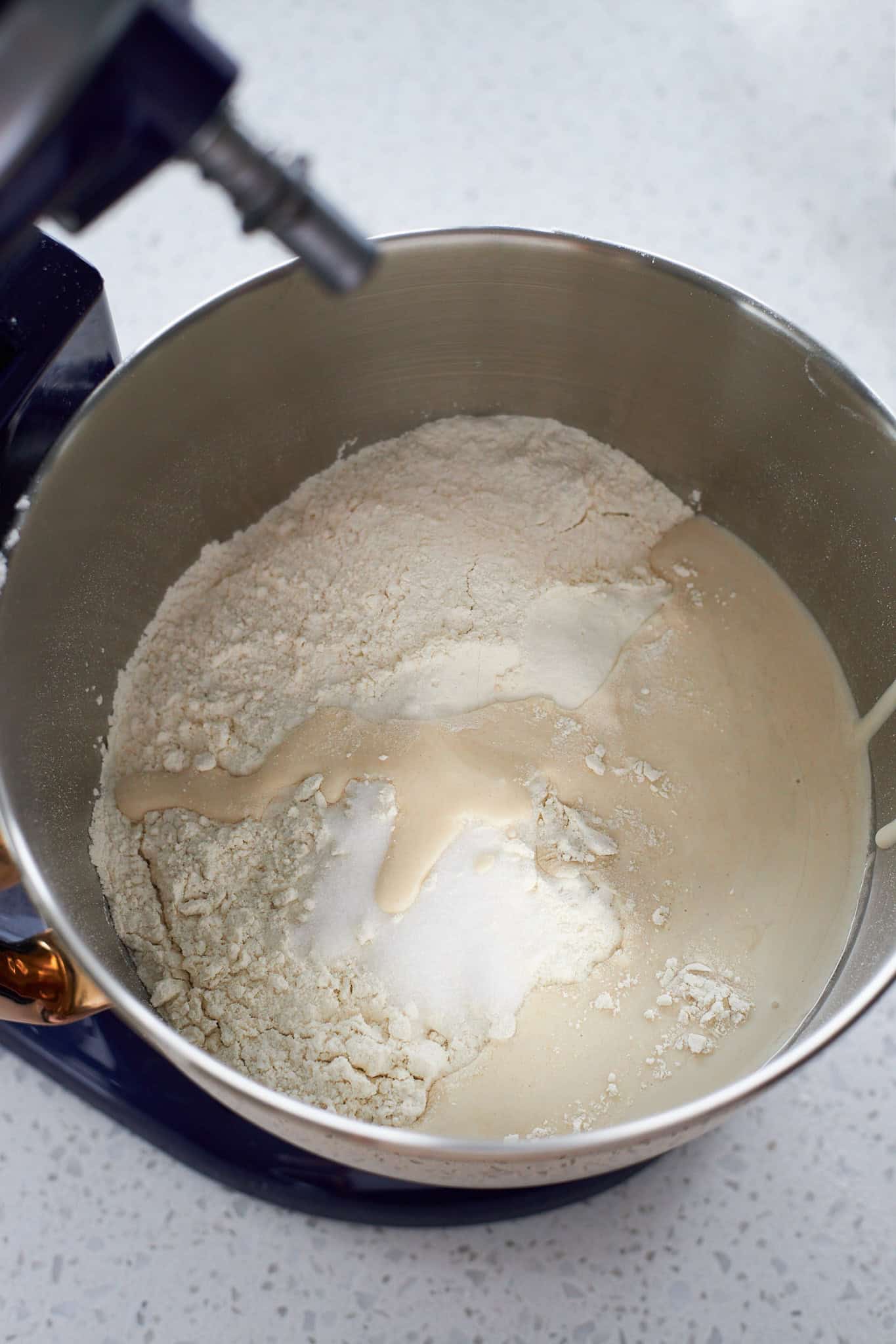 All ingredients added to the bowl of a stand mixer.