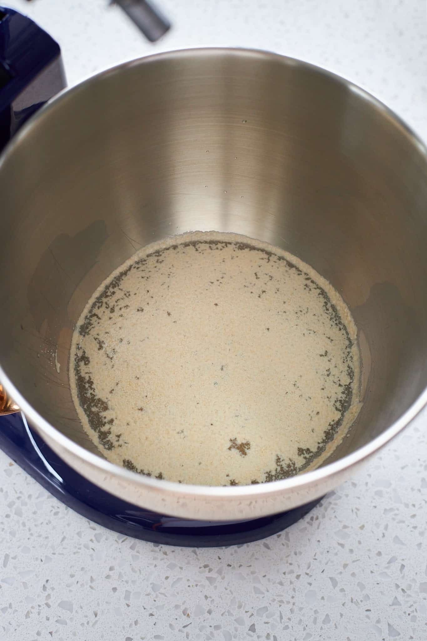 Yeast blooming on warm water in a stand mixer.