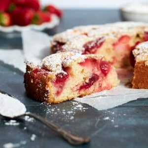 A side view of a slice of Sourdough Discard Strawberry Cake.