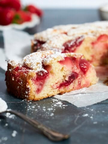 A side view of a slice of Sourdough Discard Strawberry Cake.