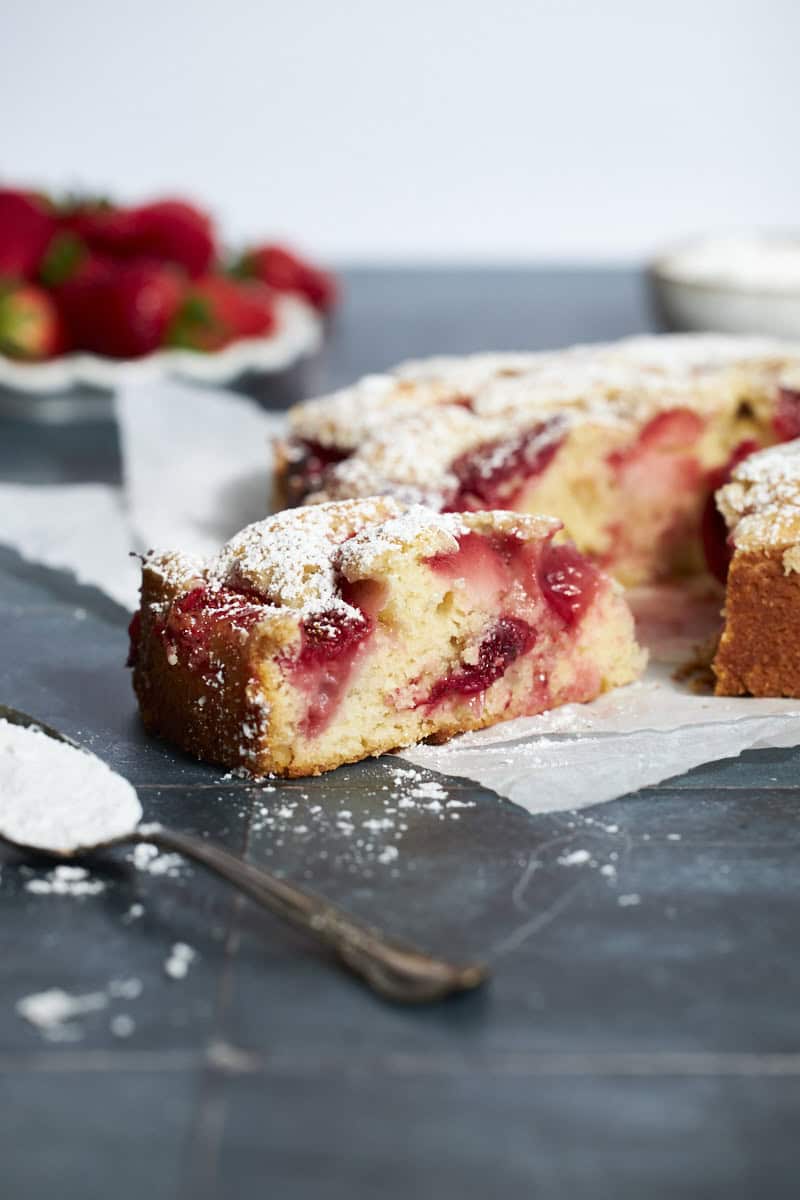 A side view of a slice of Sourdough Discard Strawberry Cake.