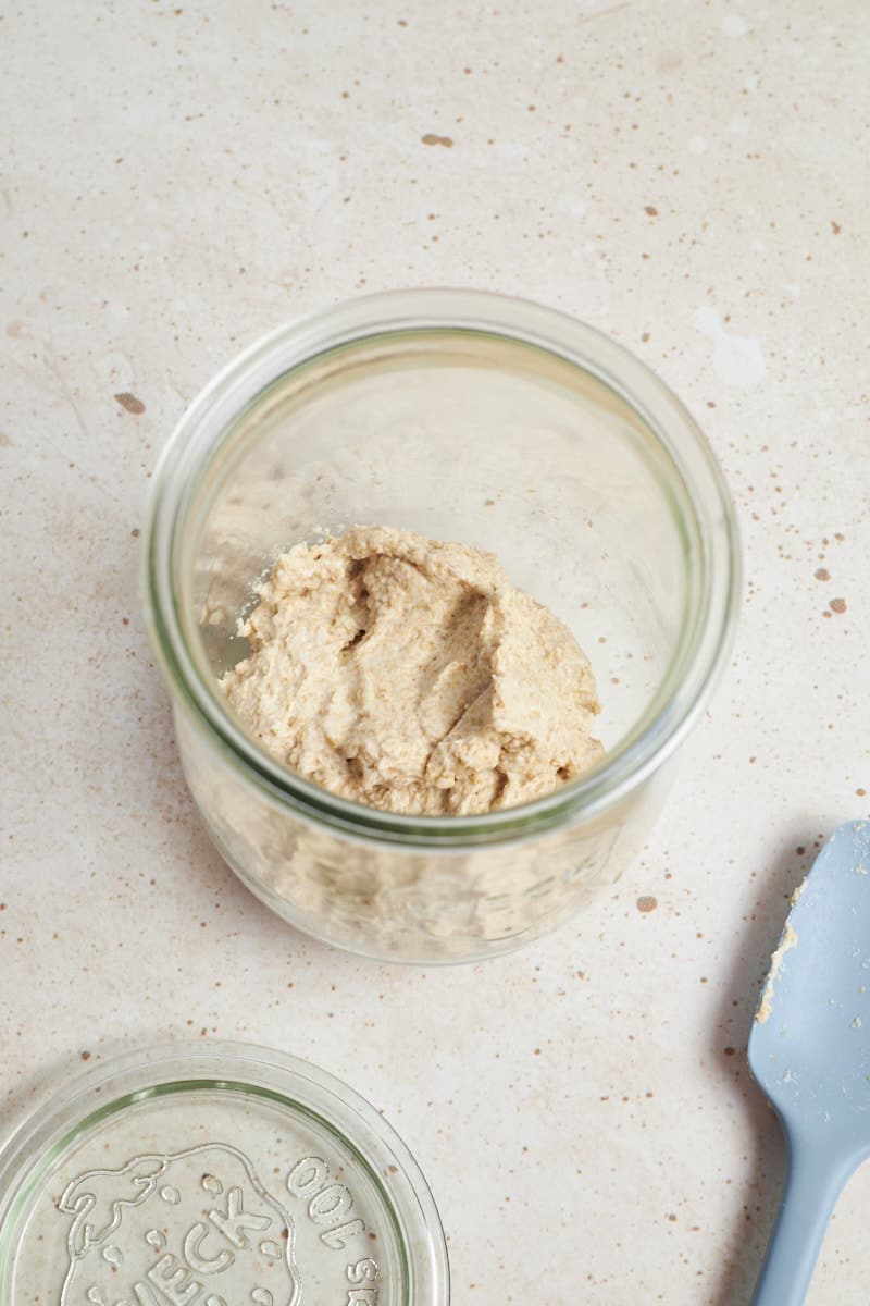 Overhead view of sourdough starter in a jar.