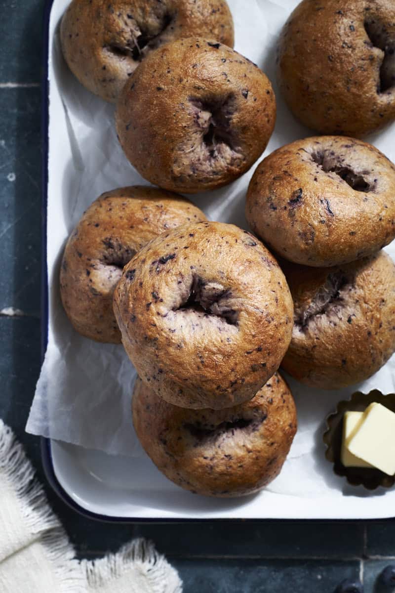 A stack of Sourdough Discard Blueberry Bagels.