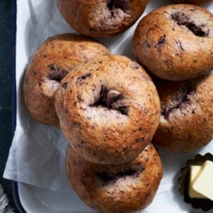 A stack of Sourdough Discard Blueberry Bagels.