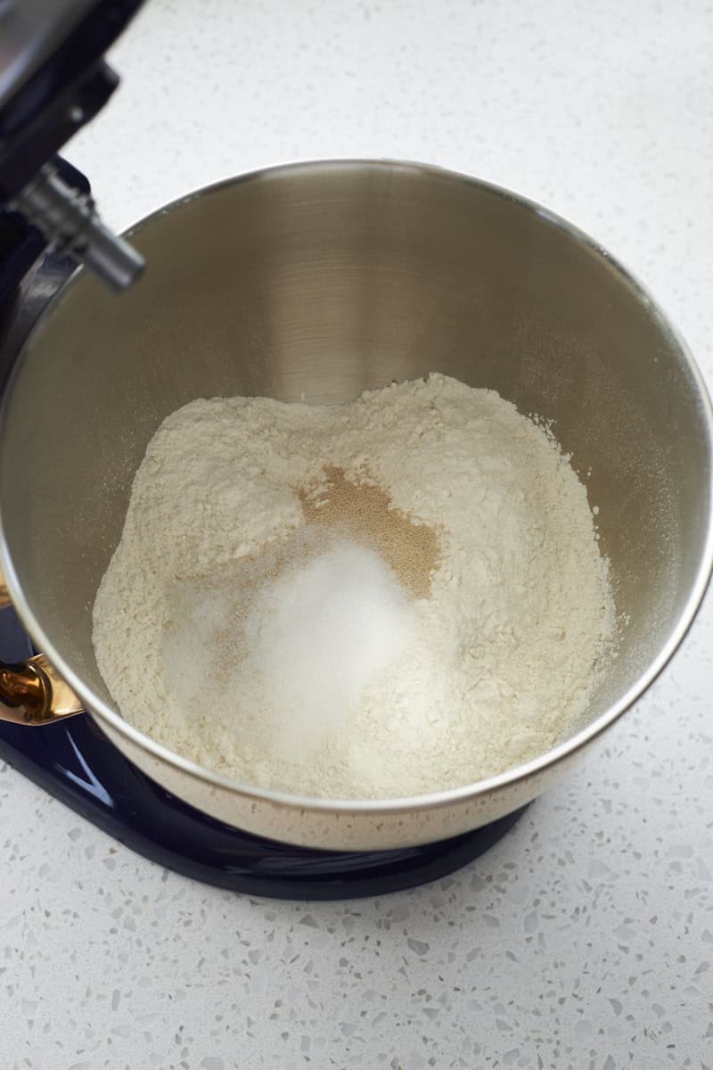 Dry ingredients in the bowl of a stand mixer.