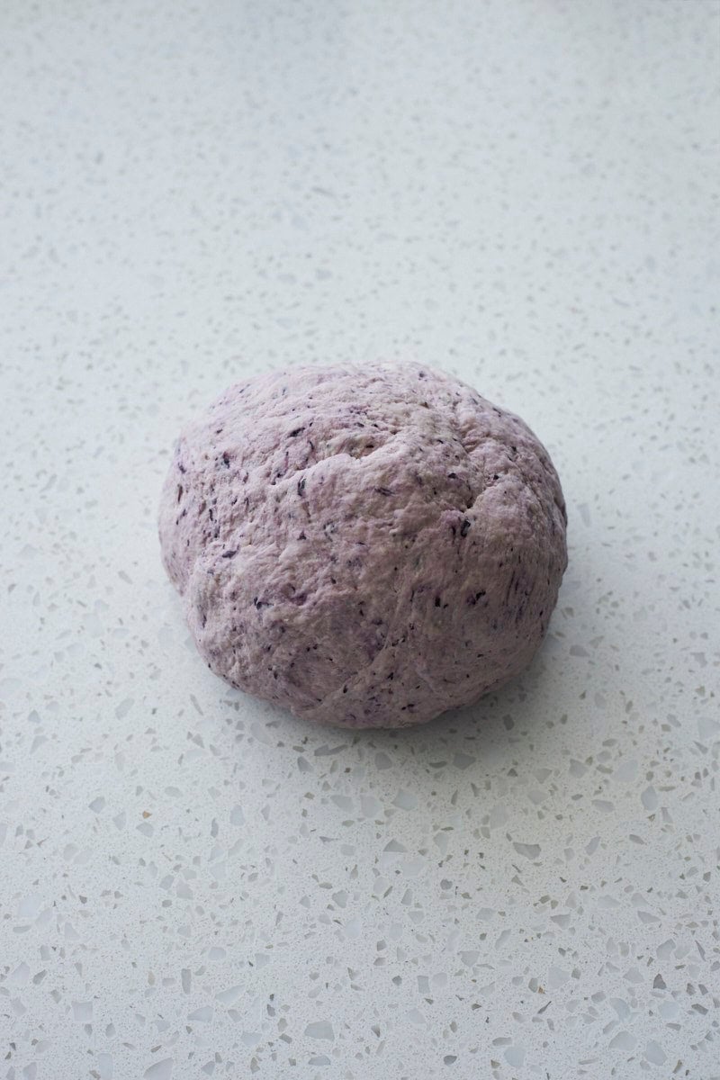 A ball of dough for Sourdough Discard Blueberry Bagels.