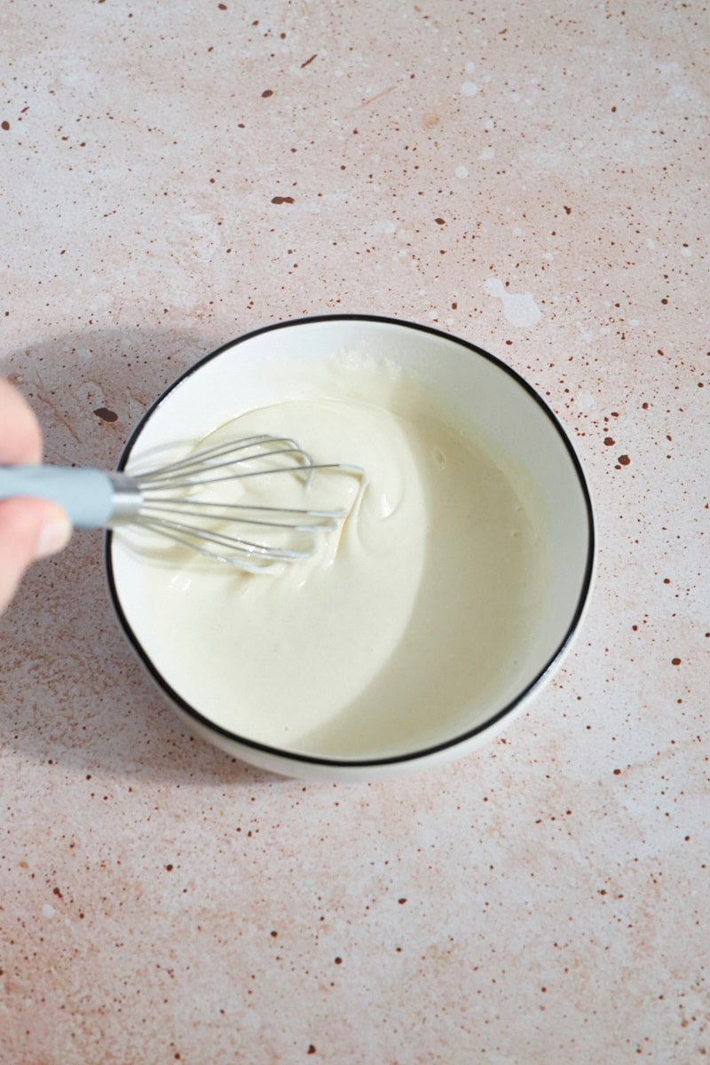 Sourdough discard and vinegar mixed in a small bowl.