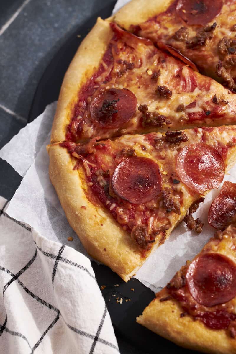 An overhead view of Sourdough Discard Pizza Dough with thick crust.