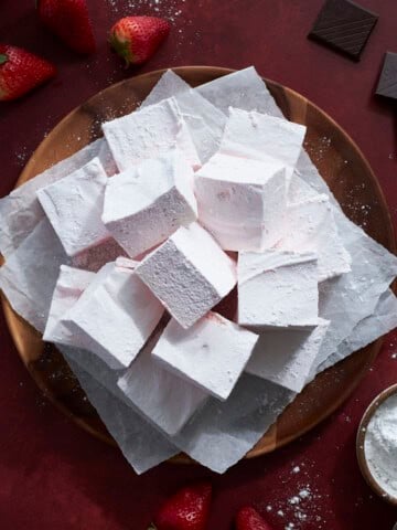 Strawberry Pink Marshmallows on a wooden tray.