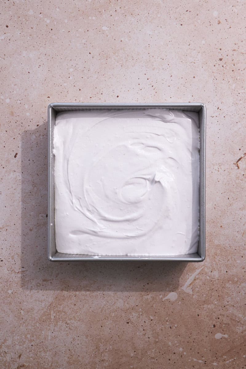 Marshmallows spread in the pan.