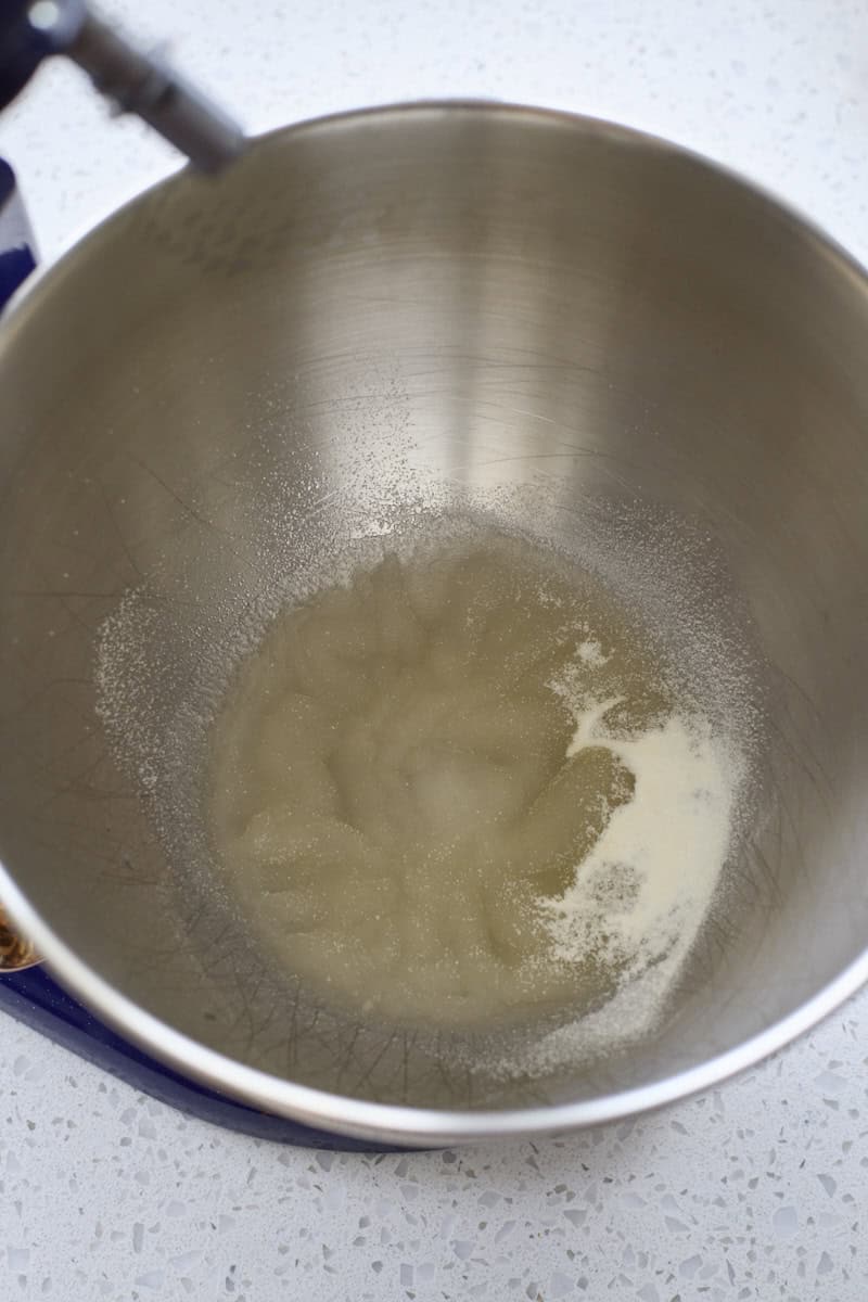 Gelatin blooming in the bowl of a stand mixer.