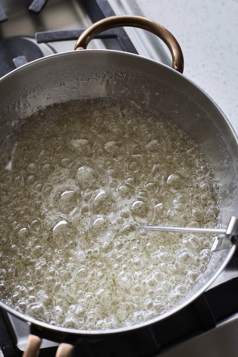Sugar mixture boiling in a pot.