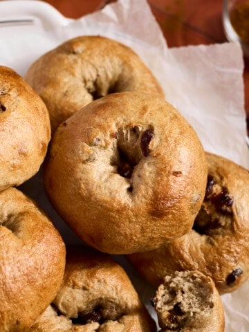 Sourdough Discard Cinnamon Raisin Bagels in a pile.
