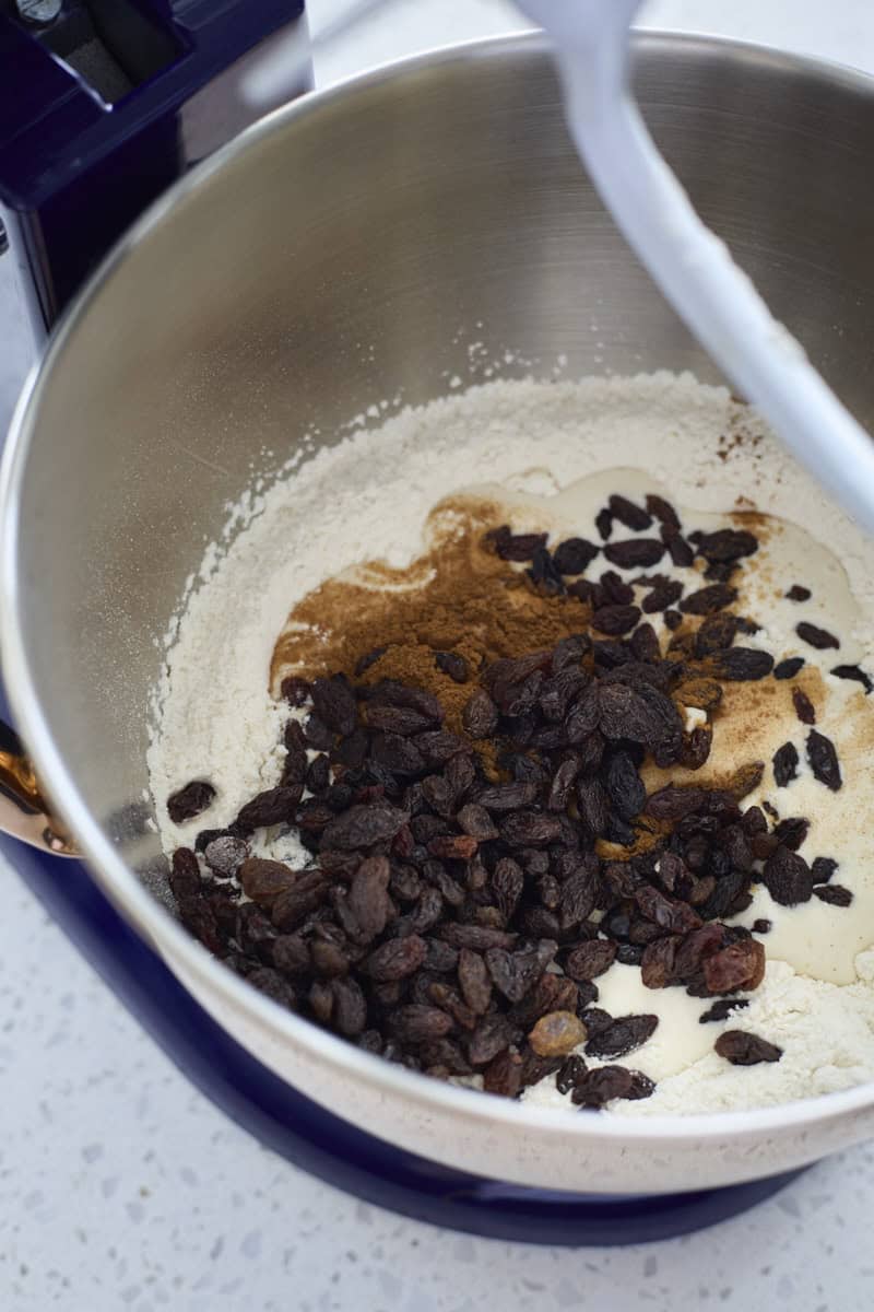 Raisins, cinnamon and sourdough discard added to the mixing bowl.
