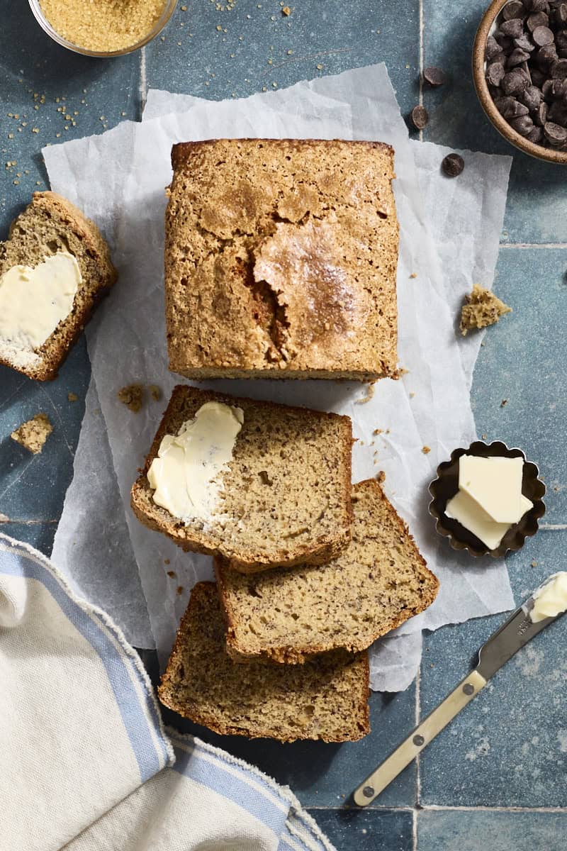 A loaf of Sourdough Discard Banana Bread cut into slices.