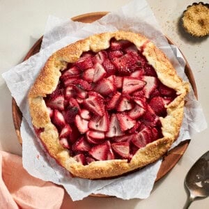 Sourdough Discard Strawberry Galette on a wooden serving plate.