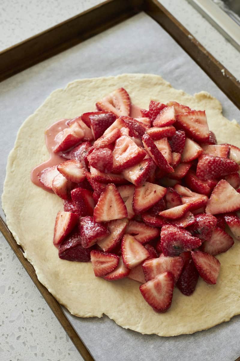 Strawberry filling piled into the center of the galette.