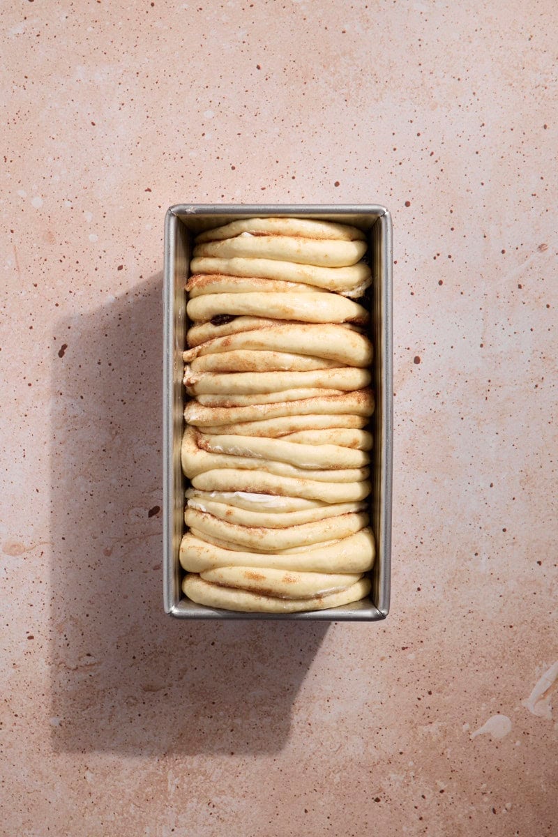 Sourdough Discard Cinnamon Roll Pull Apart Bread in the baking pan before baking.