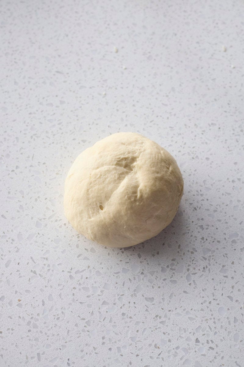 Dough after kneading on a work surface.