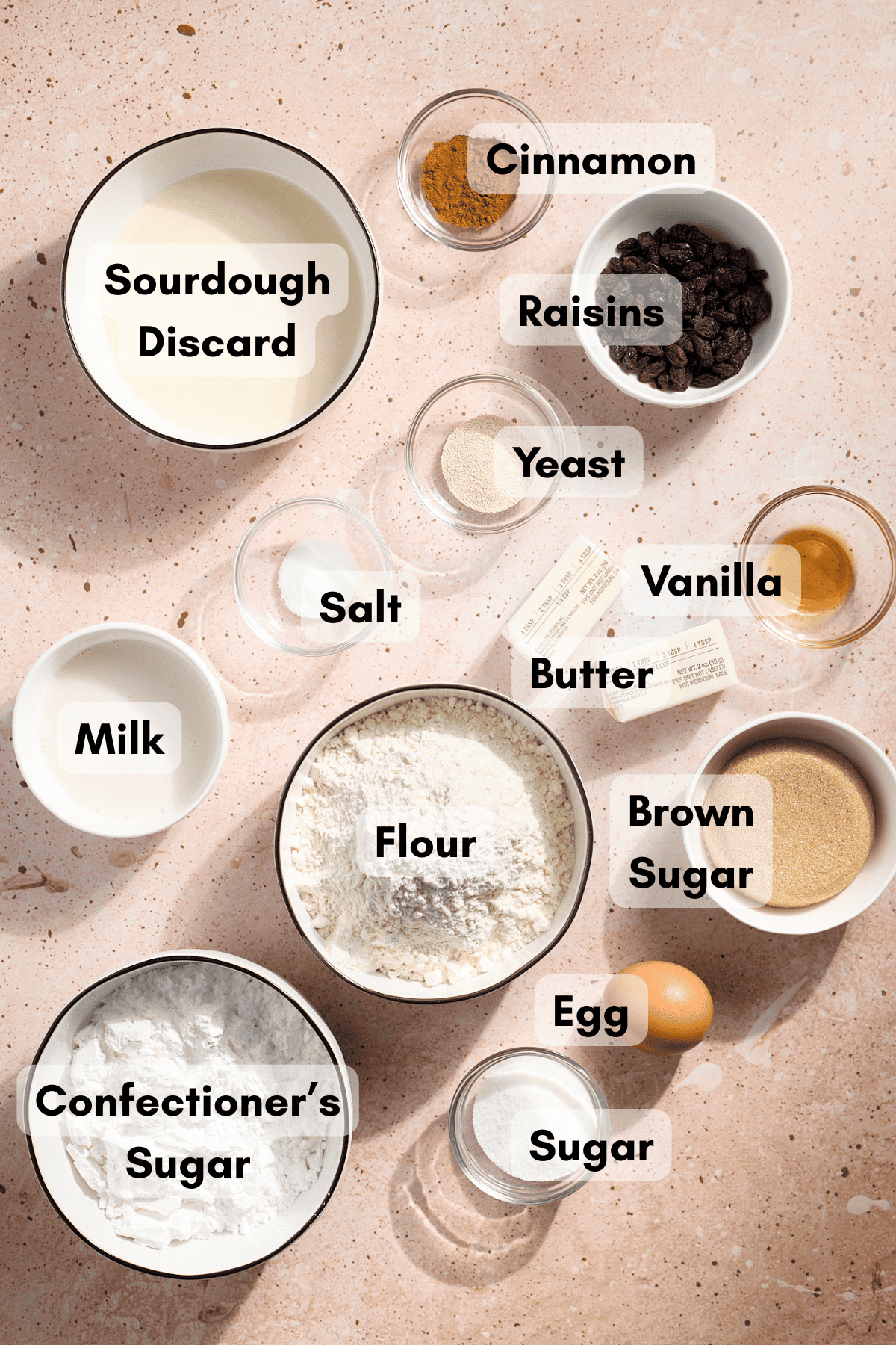 Ingredients for Sourdough Discard Cinnamon Roll Pull Apart Bread in small bowls. 