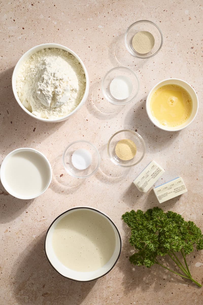 Ingredients for Sourdough Discard Garlic Knots in small bowls.