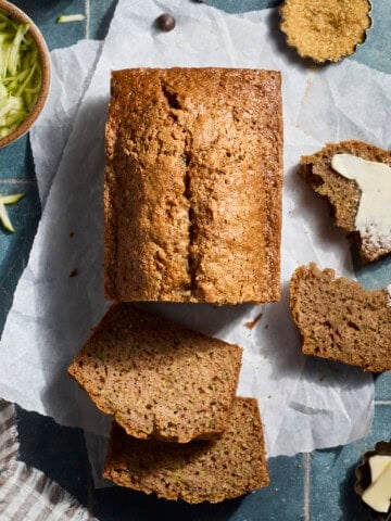 Sliced Sourdough Discard Zucchini Bread on parchment paper.