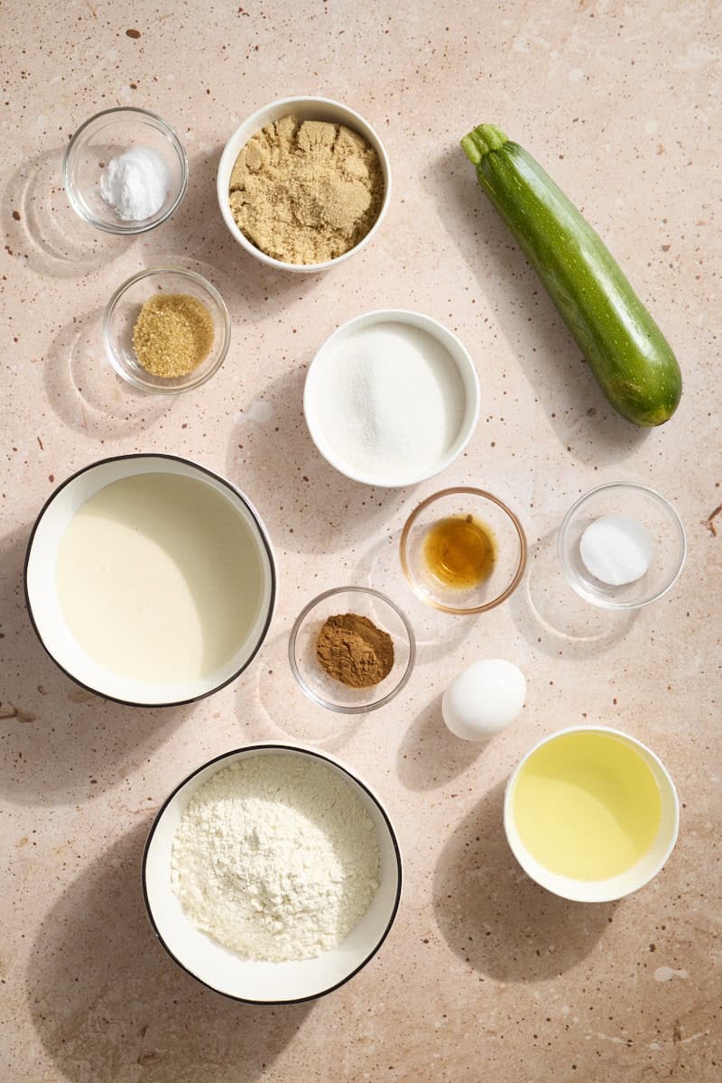 Ingredients for Sourdough Discard Zucchini Bread in small bowls.