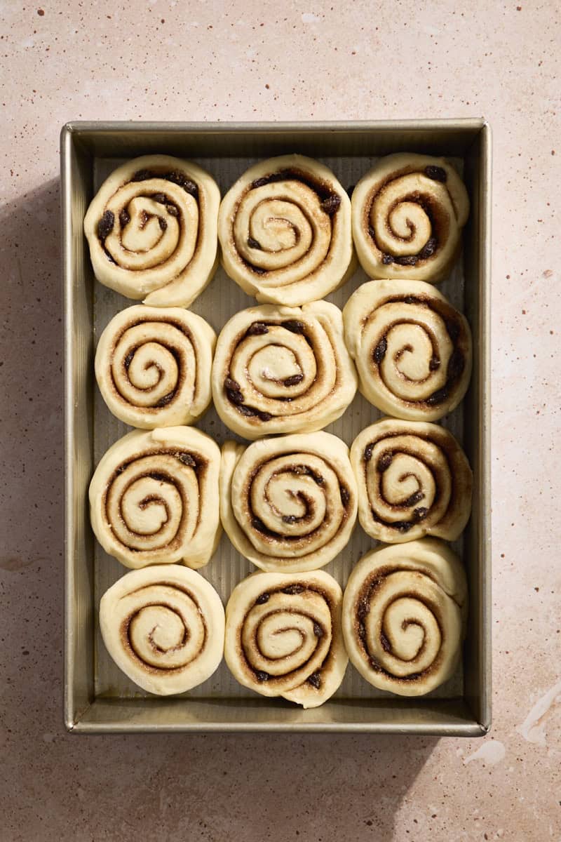 Sourdough Discard Cinnamon Rolls after the second rise in a baking pan.