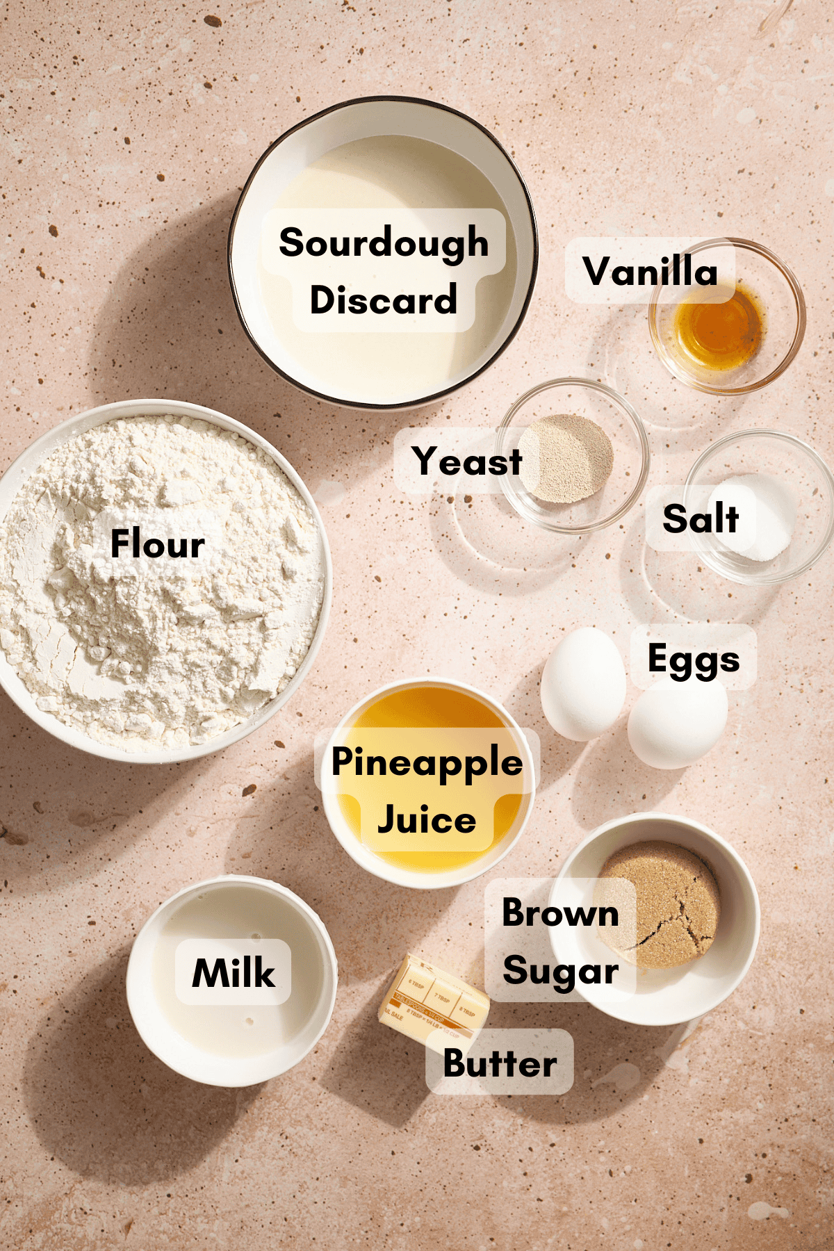 Ingredients for Sourdough Discard Hawaiian Rolls in small bowls. 